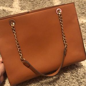 This a light brown a new day purse
